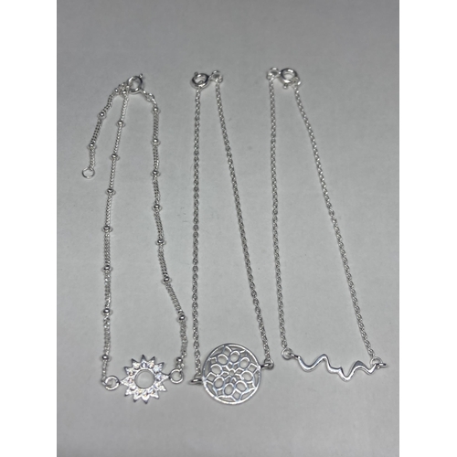 532 - THREE VARIOUS SILVER BRACELETS WOTH PENDANT DECORATION