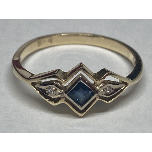 533 - A MARKED 14 CARAT GOLD RING WITH CENTRE SAPPHIRE WITH A DIAMOND EACH SIDE SIZE M GROSS WEIGHT 1.77 G... 