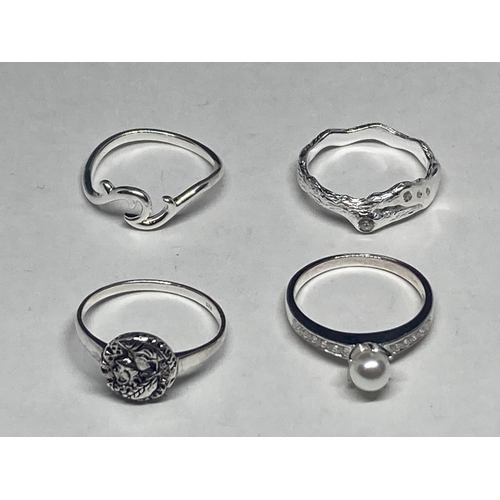 541 - FOUR VARIOUS SILVER RINGS