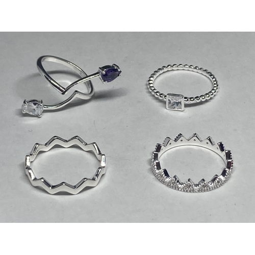 542 - FOUR VARIOUS SILVER RINGS