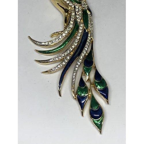 578 - A LARGE RHINESTONE STUDDED PEACOCK BROOCH