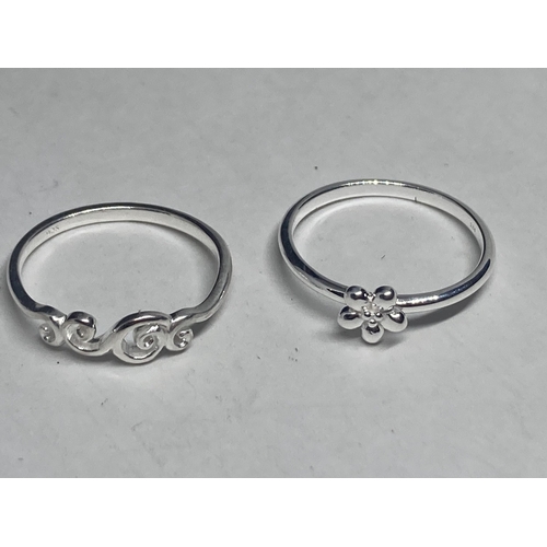 580 - FOUR VARIOUS SILVER RINGS