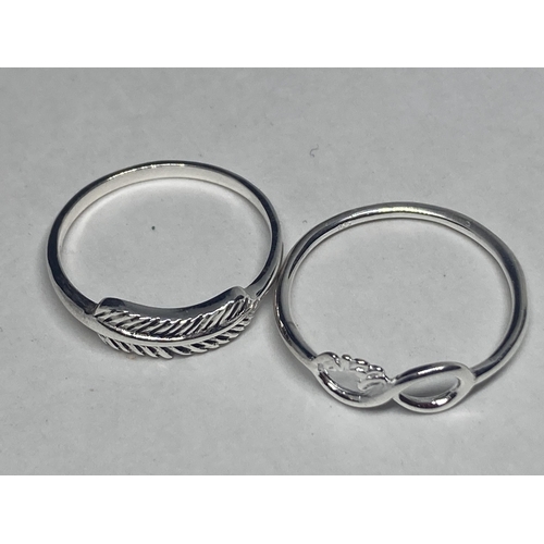 581 - FOUR VARIOUS SILVER RINGS