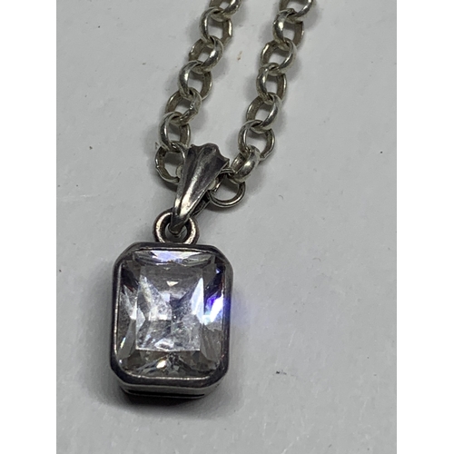 595 - A MARKED SILVER BELCHER CHAIN NECKLACE WITH A CLEAR STONE PENDANT IN A CASE