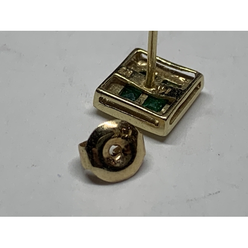 599 - A PAIR OF MARKED 9 CARAT GOLD SQUARE EARRINGS WITH EMERALDS IN A PRESENTATION BOX