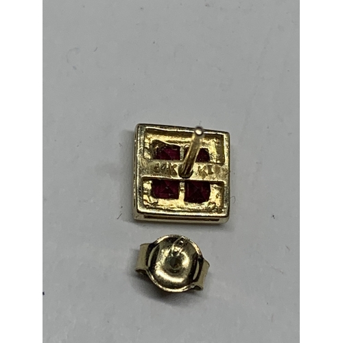 600 - A PAIR OF MARKED 9 CARAT GOLD SQUARE EARRINGS WITH RUBYS IN A PRESENTATION BOX