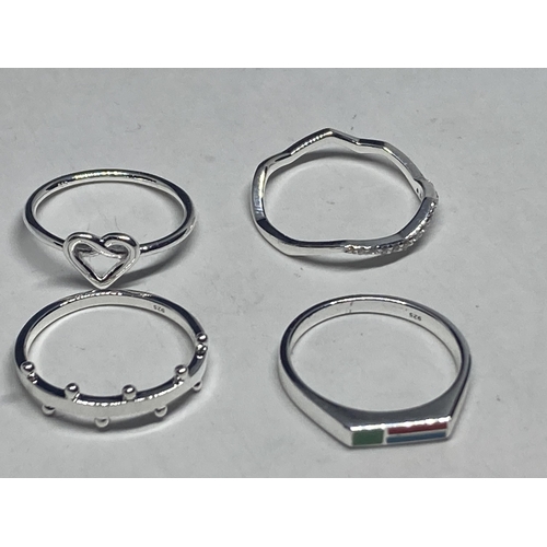 620 - FOUR VARIOUS SILVER RINGS