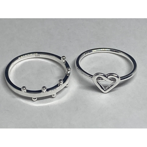 620 - FOUR VARIOUS SILVER RINGS