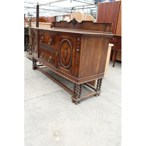 2842 - AN EARLY 20TH CENTURY OAK SIDEBOARD WITH RAISED BACK, TWO CUPBOARDS, TWO DRAWERS, THREE BARLEY-TWIST... 