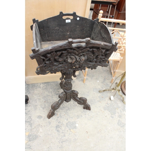 2846 - A 19TH CENTURY BLACK FOREST PLANTER WITH CARVED FRONT ON SHAPED TRIPOD COLUMN, 38