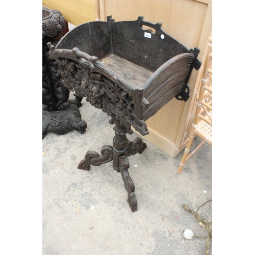 2846 - A 19TH CENTURY BLACK FOREST PLANTER WITH CARVED FRONT ON SHAPED TRIPOD COLUMN, 38