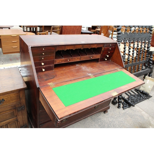 2852 - A GEORGE III MAHOGANY AND CROSSBANDED BUREAU WITH FITTED INTERIOR, TWO SHORT AND THREE LONG GRADUATE... 