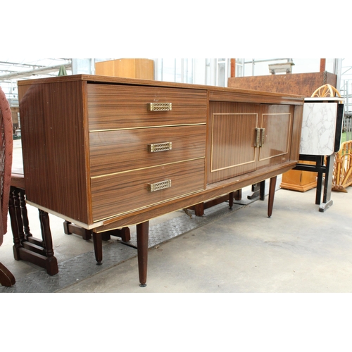 2885 - A RETRO WALNUT EFFECT SIDEBOARD ON TAPERING LEGS ENCLOSING THREE DRAWERS AND TWO CUPBOARDS, 66