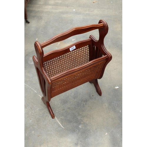 2896 - A MAGAZINE RACK WITH CANE SIDES