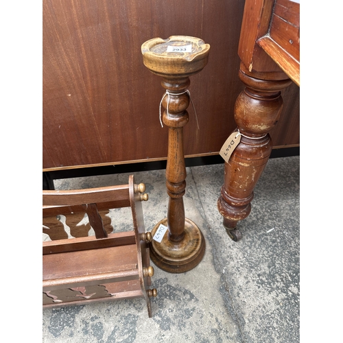 2933 - AN OAK FIRESCREEN, MAGAZINE RACK AND AN ASH TRAY STAND