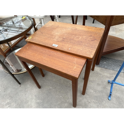 2943 - A RETRO TEAK NEST OF THREE TABLES AND A STOOL