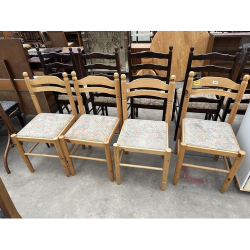 2945 - A SET OF FOUR PINE DINING CHAIRS WITH CURVED BACK RAILS