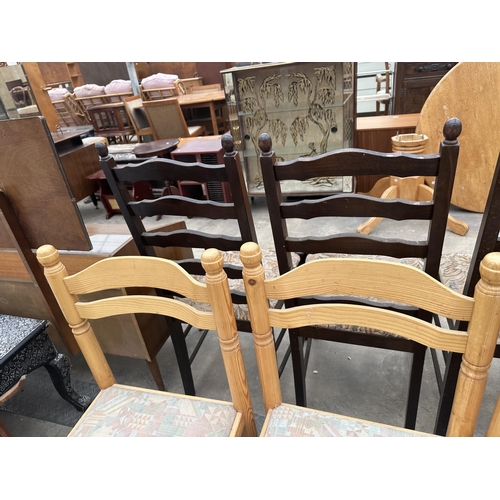 2945 - A SET OF FOUR PINE DINING CHAIRS WITH CURVED BACK RAILS