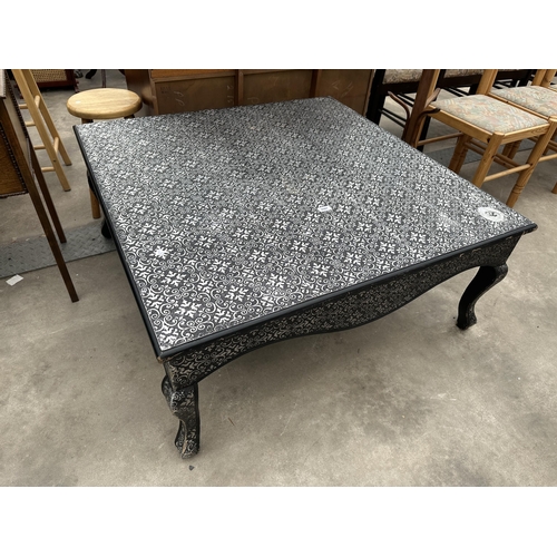 2947 - A SILVER AND BLACK LOW COFFEE TABLE ON CABRIOLE LEGS, 41.5