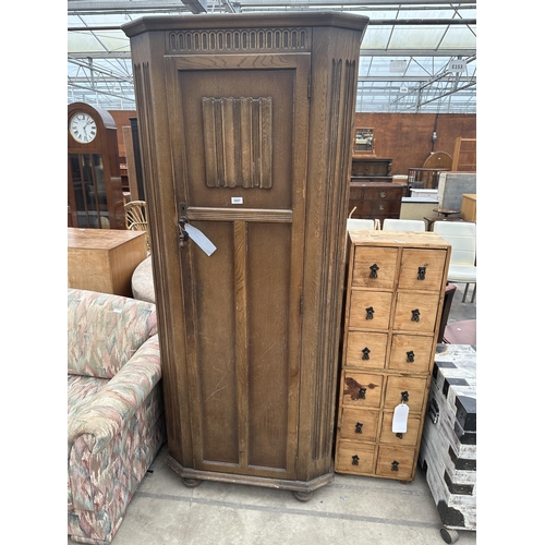 2957 - A MID 20TH CENTURY OAK HALL WARDROBE WITH LINEN FOLD PANEL, 31