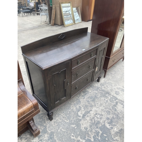 3007 - AN EARLY 20TH CENTURY OAK SIDEBOARD ENCLOSING THREE DRAWERS, TWO CUPBOARDS, 51