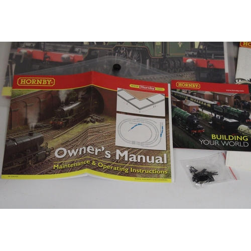 331 - TWO HORNBY ANALOGUE CONTROLLERS (ONE AS NEW IN BOX), A TRAKMAT, PLUS TWO BOOKLETS - TRACK PLANS AND ... 