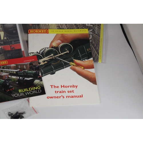 331 - TWO HORNBY ANALOGUE CONTROLLERS (ONE AS NEW IN BOX), A TRAKMAT, PLUS TWO BOOKLETS - TRACK PLANS AND ... 