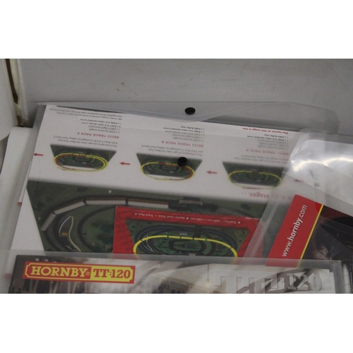 331 - TWO HORNBY ANALOGUE CONTROLLERS (ONE AS NEW IN BOX), A TRAKMAT, PLUS TWO BOOKLETS - TRACK PLANS AND ... 