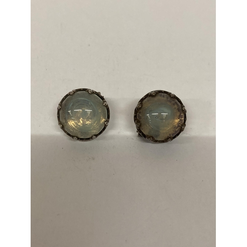 689 - A PAIR OF VINTAGE BLUE GLASS CABACHON CLIP ON EARRINGS (POSSIBLY SILVER)