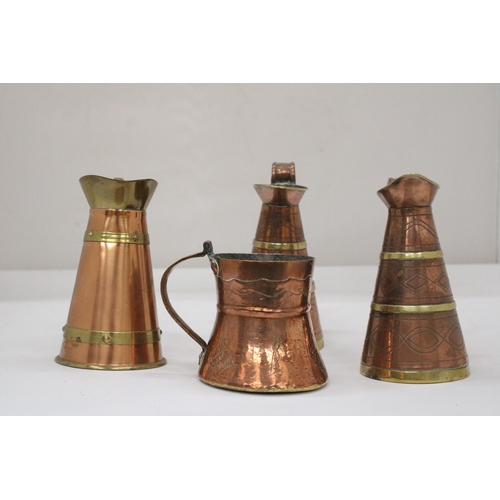 117 - FOUR VINTAGE BRASS AND COPPER JUGS