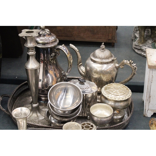 144 - A LARGE QUANTITY OF SILVER PLATE TO INCLUDE GALLERIED TRAYS, A COFFEE POT, TEAPOT, SUGAR BOWL, BUD V... 