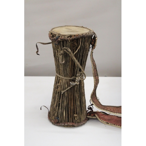 156 - AN ANTIQUE AFRICAN DRUM