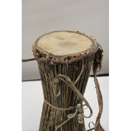 156 - AN ANTIQUE AFRICAN DRUM