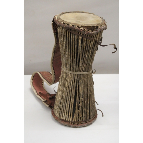 156 - AN ANTIQUE AFRICAN DRUM