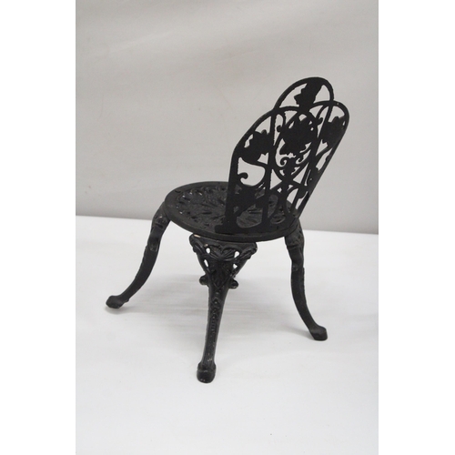 159 - A VINTAGE BLACK CAST IRON APPRENTICE PIECE CHAIR, HEIGHT 35CM