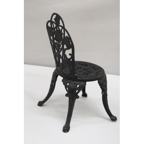 159 - A VINTAGE BLACK CAST IRON APPRENTICE PIECE CHAIR, HEIGHT 35CM