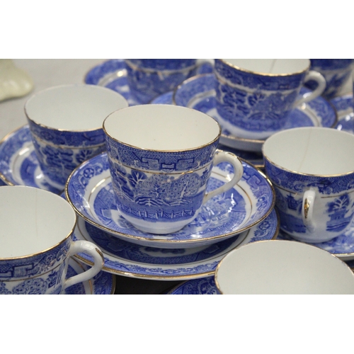 174 - A QUANTITY OF ANTIQUE BLUE WILLOW WITH GOLD TRIM TO INCLUDE SLOP BOWL, MILK JUG, CUPS, SAUCERS, SIDE... 