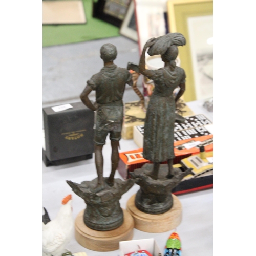 200 - TWO VINTAGE METAL FIGURES OF FARMERS ON LATER WOODEN PLINTHS, HEIGHT APPROX 36CM