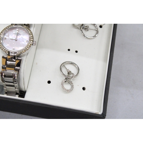 202 - A ROTARY LADIES WRISTWATCH WITH MOTHER OF PEARL FACE AND METAL STRAP, TOGETHER WITH A PAIR OF EARRIN... 