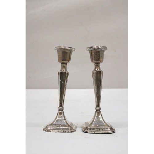 3 - A PAIR OF HALLMARKED CHESTER SILVER CANDLESTICKS WITH WEIGHTED BASES GROSS WEIGHT 155.6 GRAMS