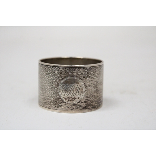 6 - A HALLMARKED BIRMINGHAM SILVER NAPKIN RING GROSS WEIGHT 62.9 GRAMS (ENGRAVED)