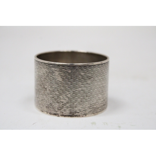 6 - A HALLMARKED BIRMINGHAM SILVER NAPKIN RING GROSS WEIGHT 62.9 GRAMS (ENGRAVED)