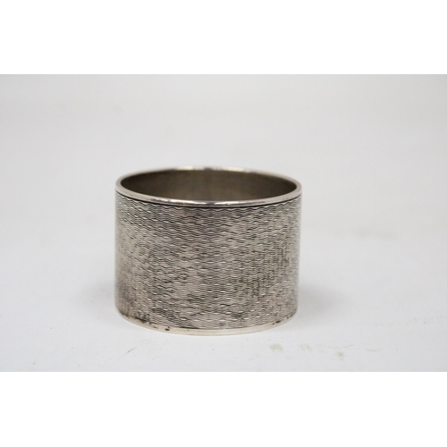 6 - A HALLMARKED BIRMINGHAM SILVER NAPKIN RING GROSS WEIGHT 62.9 GRAMS (ENGRAVED)