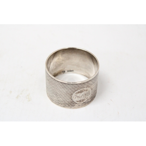 6 - A HALLMARKED BIRMINGHAM SILVER NAPKIN RING GROSS WEIGHT 62.9 GRAMS (ENGRAVED)