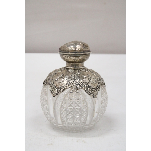 11 - A HALLMARKED BIRMINGHAM SILVER POSSIBLY VICTORIAN SCENT BOTTLE WITH ATTRACTIVE REPOUSSE SILVER DECOR... 