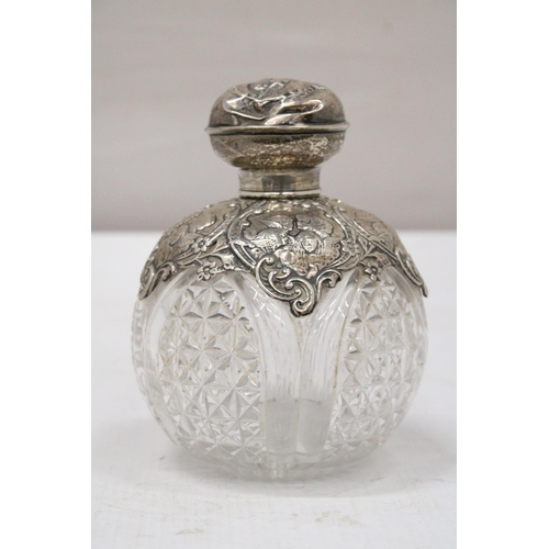 11 - A HALLMARKED BIRMINGHAM SILVER POSSIBLY VICTORIAN SCENT BOTTLE WITH ATTRACTIVE REPOUSSE SILVER DECOR... 