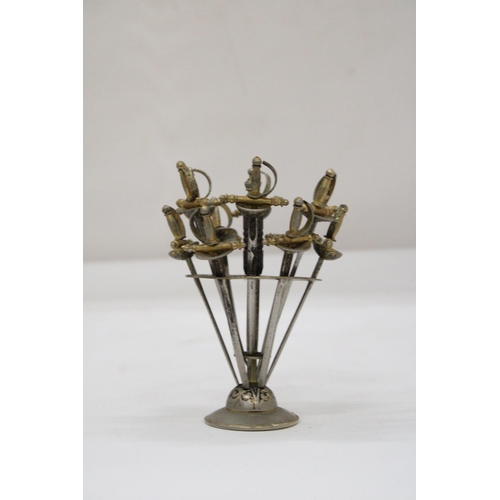 112 - A VINTAGE TOLEDO SPANISH COCKTAIL STAND WITH SWORD COCKTAIL STICKS