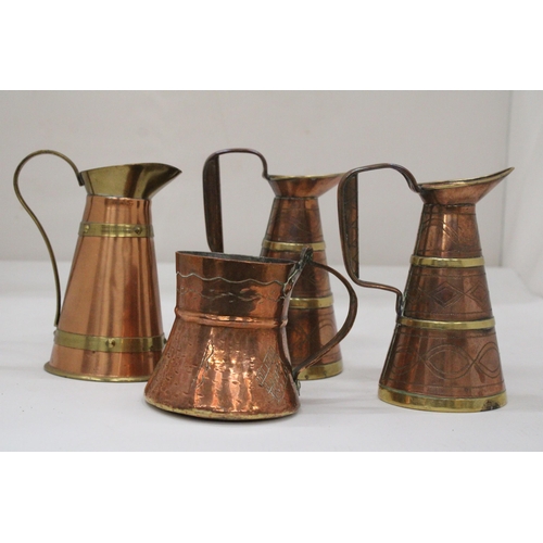 117 - FOUR VINTAGE BRASS AND COPPER JUGS