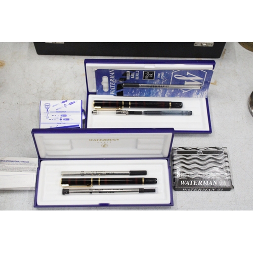 30 - A WATERMAN PARIS LAURENT BLACK FOUNTAIN PEN AND ROLLER BALL PEN SET BOTH CASED WITH REFILLS