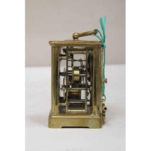 31 - AN AIG LE REVEIL CARRIAGE CLOCK WITH FACETTED GLASS PANELS NO. 12685 WITH KEY